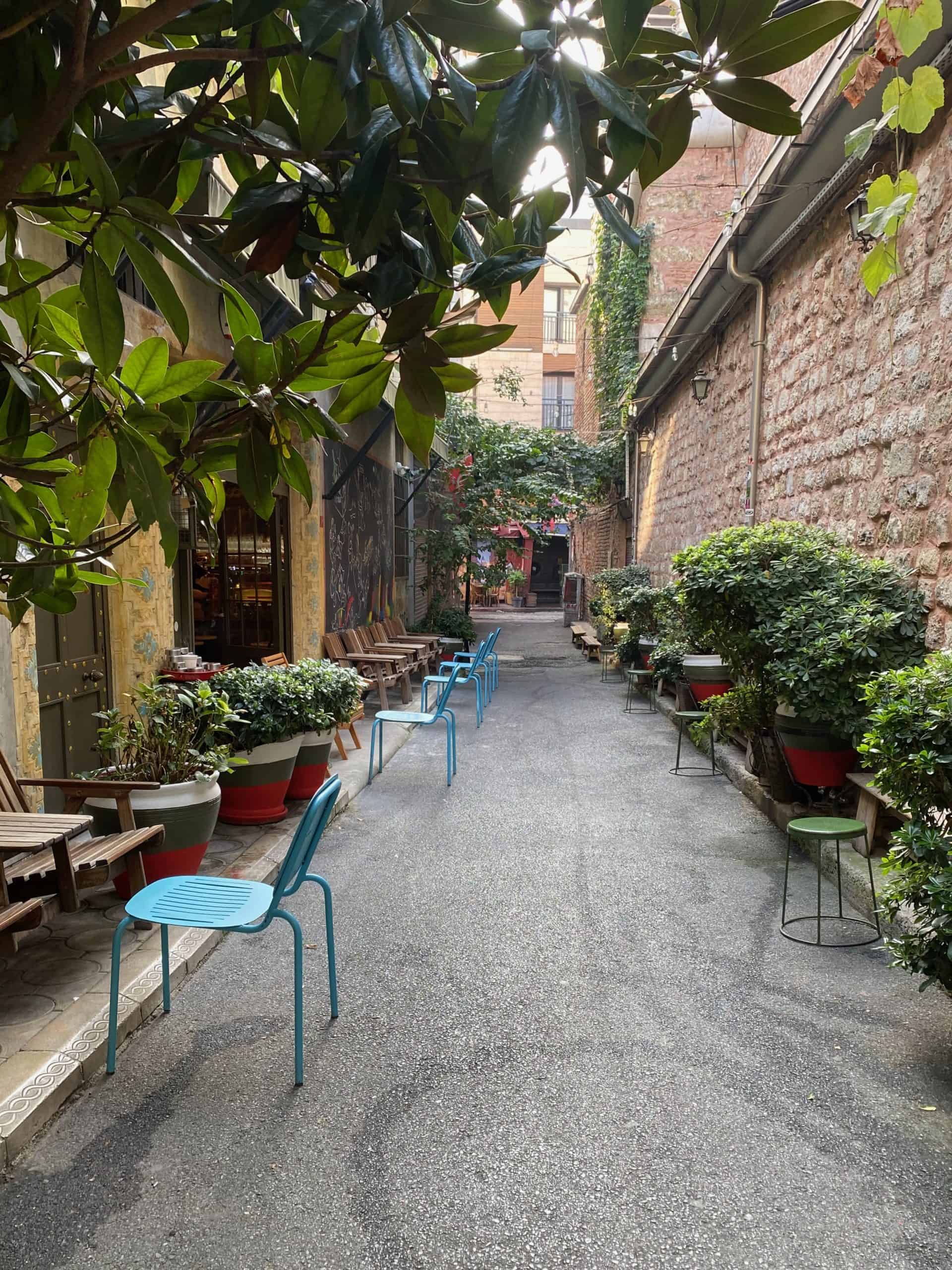 Backstreet lined with blue chairs in Karakoy, Istanbul.