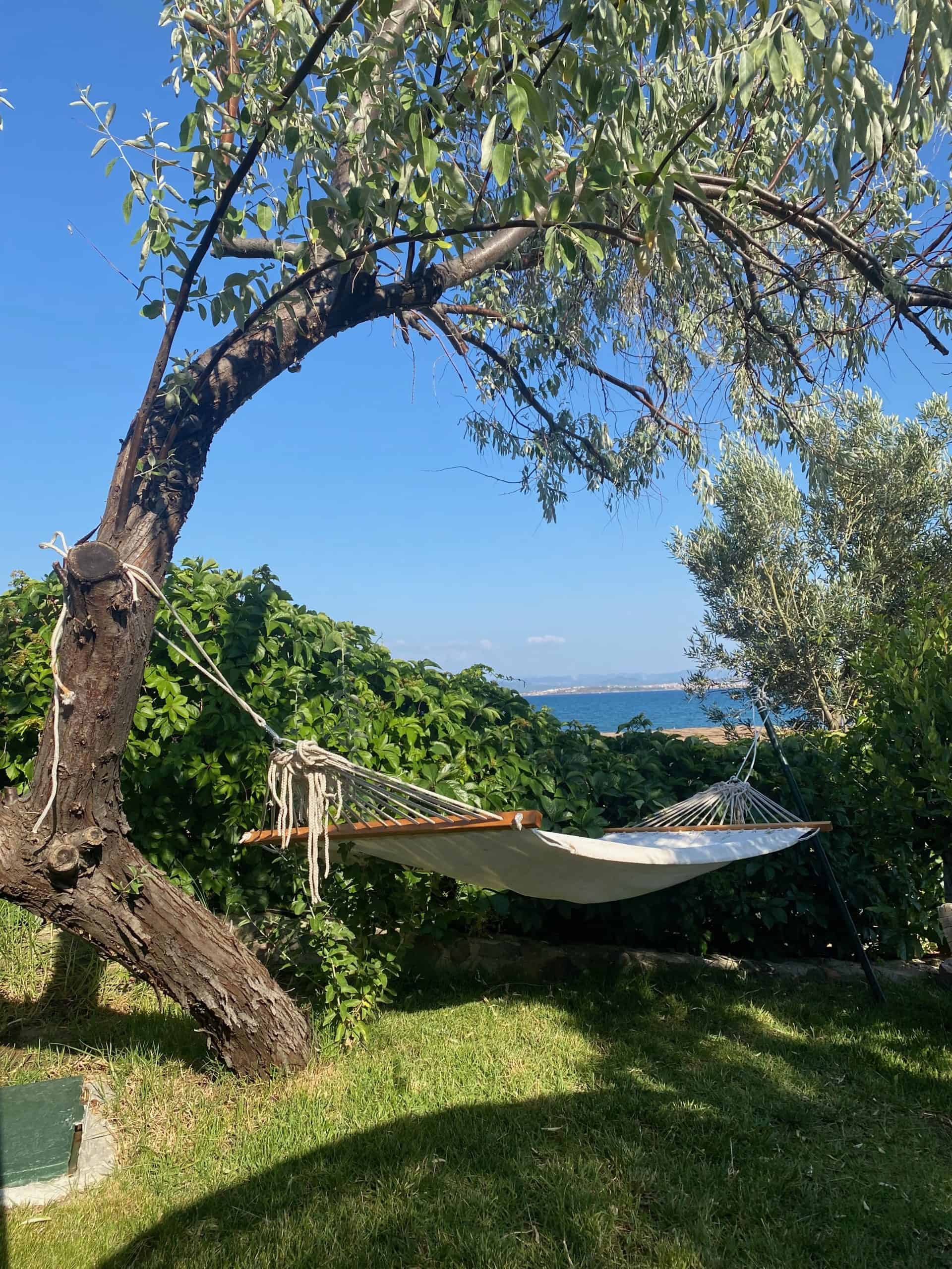 Hammock hanging on Sobe Beach in Cunda Island.