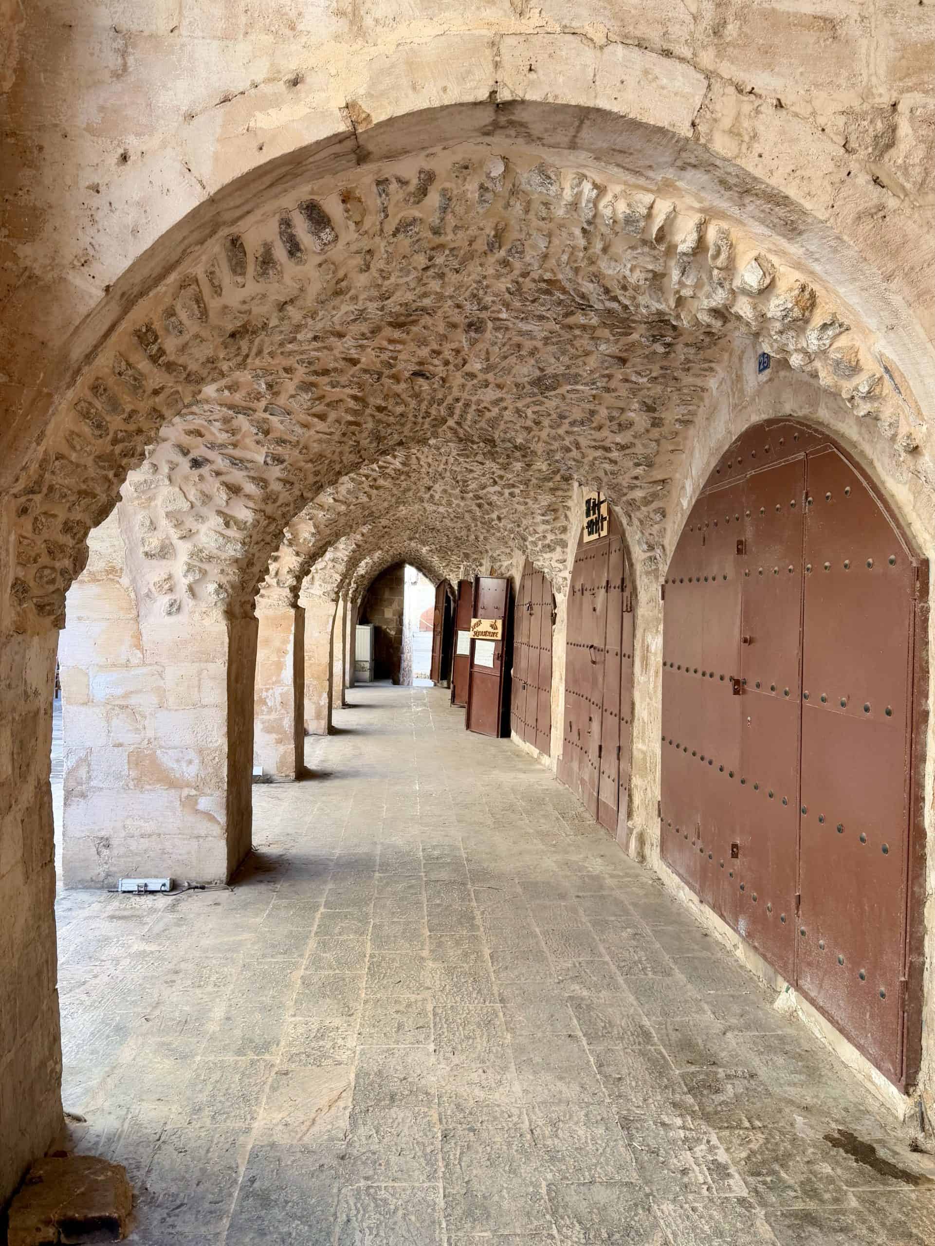 Bazaar with traditional stone porticoes in Mardin Old Town.