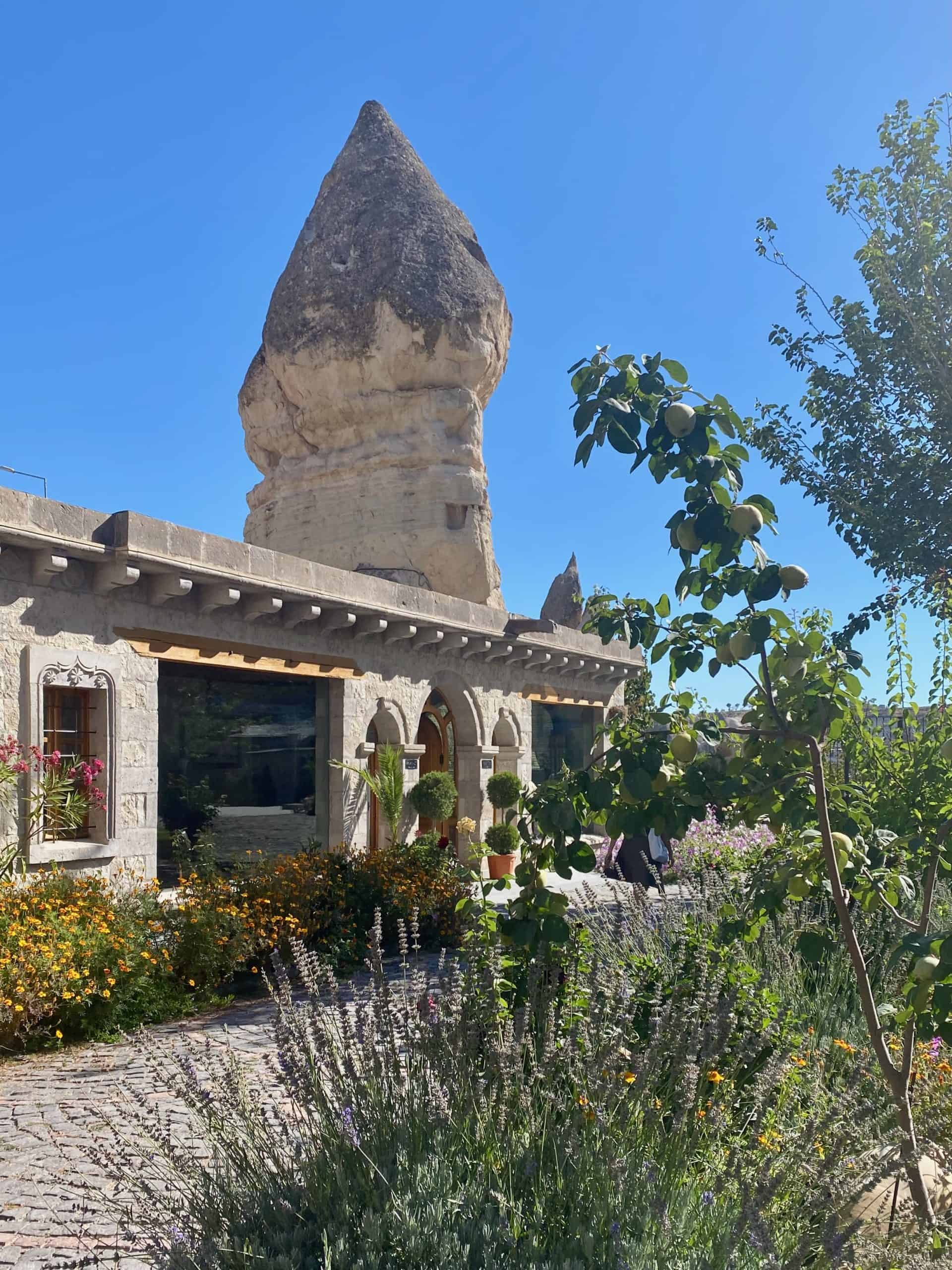 "Fairy Chimney" rock formations behind a hotel in Cappadocia